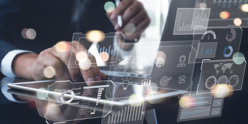 Data scientists, Programmer using digital tablet and laptop computer analyzing information on futuristic virtual interface screen. Algorithm, Data engineering, business and digital software technology